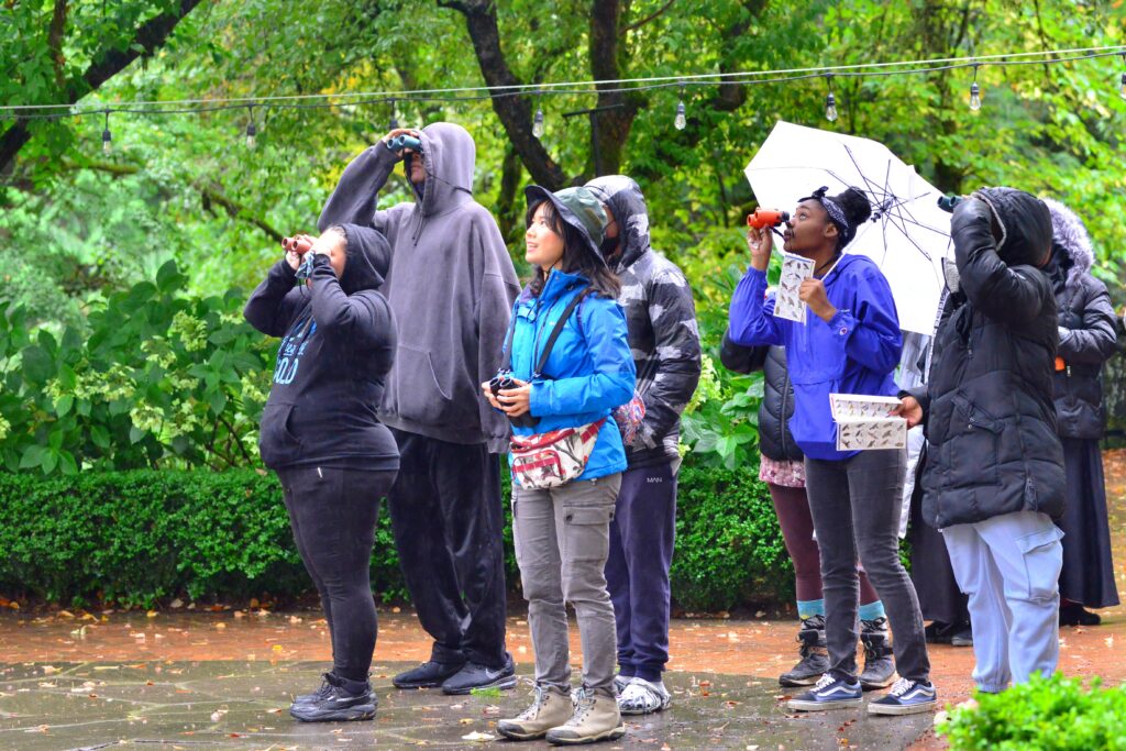 Leading a group of students on a bird trip. 
Photo credit: Siyuan Yu